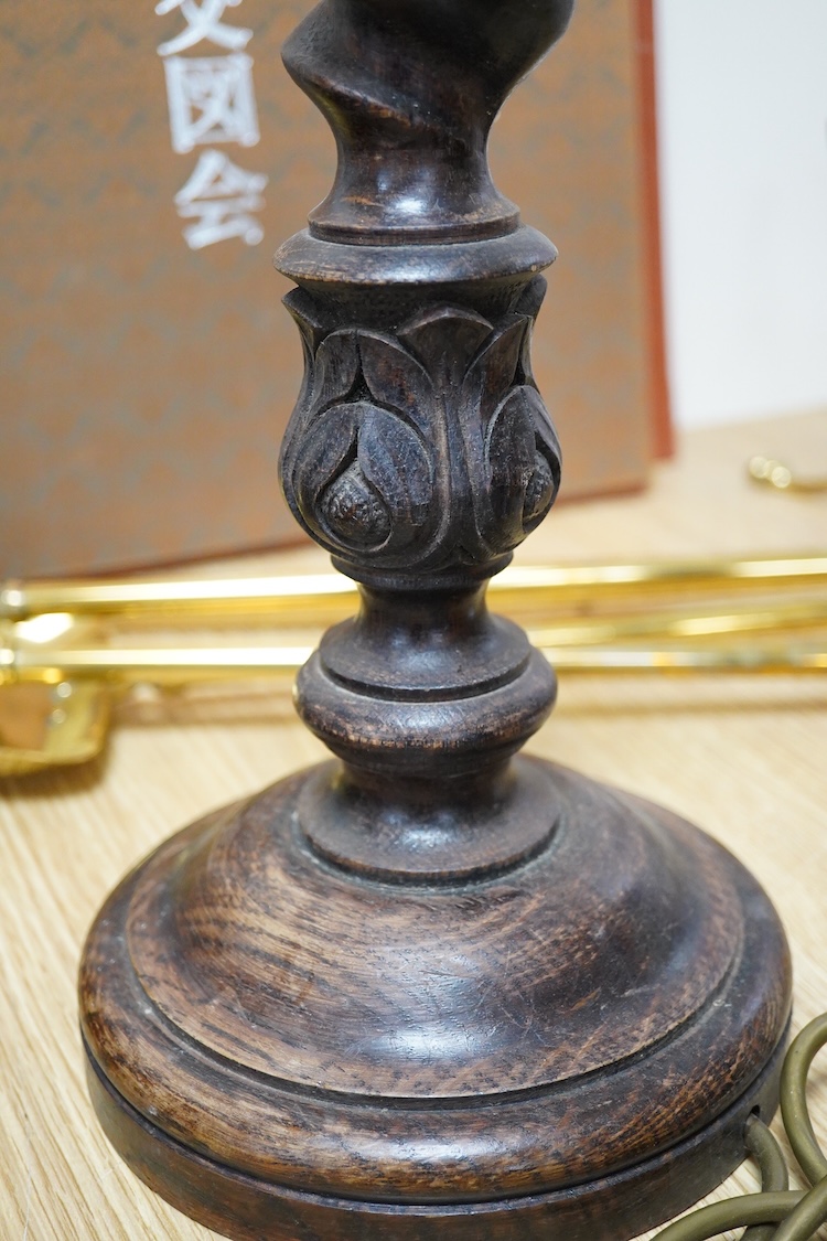 A pair of carved oak barley twist table lamps, 42cm